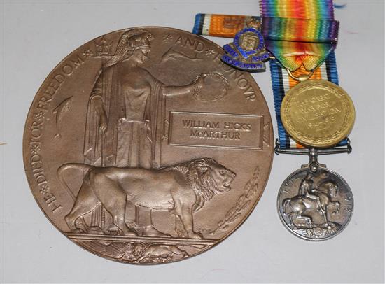 A death plaque, a pair of WWI medals and a silver badge